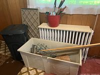 Overall lot with bin, trash can, garden tools and wire supports