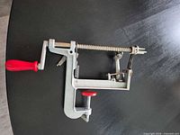 full view of apple peeler corer slicer showing clamp, handle and mechanism