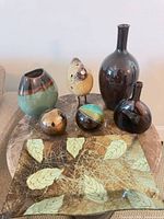All seven decorative pieces grouped on tabletop