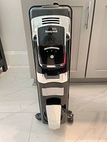 Front view showing Honeywell branding, control panel, and caster base