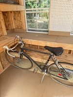 Left side view of entire bicycle showing frame, wheels, handlebars