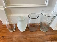 all four vases side by side showing shapes and finishes