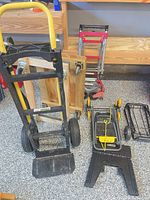 Group shot showing hand truck, platform dolly, folding carts and step stool