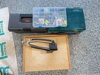 Stacked tackle boxes and wooden drawer