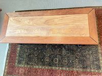 Top view showing two-tone wood surface and border detail