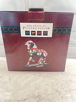 Front of retail box showing product branding and silhouette