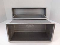 Front view showing three corrugated metal pans stacked
