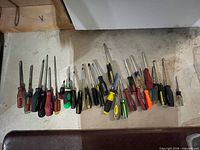 screwdrivers laid out showing variety of types and sizes