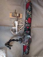 Mini iron, magnifier and rolled quilting frame