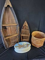 Group shot showing two boat shelves, ceramic box, wicker basket