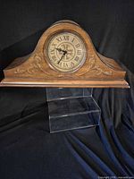 Front view of Bombay Company wood mantel clock