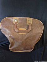 Brown faux-leather bowling ball carry case front view