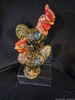 Both Department 56 ceramic rooster figurines front view
