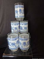 Five tumblers stacked and grouped showing full pattern coverage