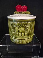 front view of green ceramic canister showing COFFEE text