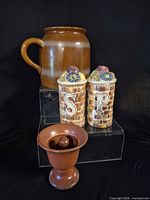 Overall view of pitcher, salt & pepper shakers, and flower frog