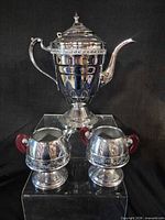 Front view of coffee urn and two matching cups