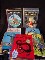 All seven Tintin hardcover books displayed front covers