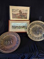 Group shot showing two brass plates and two framed prints