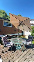 table umbrella chairs on deck