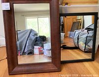 Both mirrors side by side showing frame colors and sizes