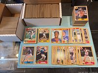 Boxes and stacks of 1987 Topps baseball cards plus selected star cards