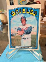 Front view of card on stand showing image, border, and player name
