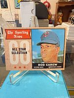 Front of Rod Carew All Star Selection card on stand