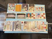 overview of stack of Topps baseball cards and notable cards laid out