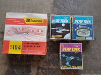 Four boxed kits: three AMT Star Trek, one Rivarossi turntable