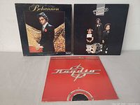 Front covers of all three LPs displayed