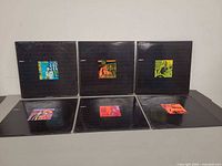 Front view of six LP sleeves phases 1-6
