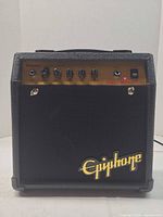 Front view of Epiphone Studio Bass 10S amplifier showing cabinet, grill, logo, control panel