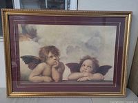 Full view of framed Raphael cherub print