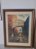 Full view framed color print under glass