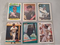 Six sleeved cards featuring Bobby Bonilla and Barry Bonds