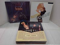 Stacked LPs showing Beatles, Madonna, Roxette covers