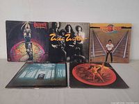 Group shot of all five LPs showing front covers