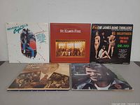 Five of the LP jackets displayed: Beverly Hills Cop, St. Elmo’s Fire, The James Bond Thrillers, Frank Sinatra, Wham!