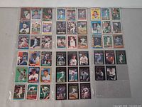 Four 9-pocket sheets showing Roger Clemens cards front side