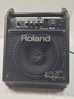 Front view showing grille, logos and enclosure