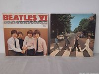 Front covers of Beatles VI and Abbey Road LPs