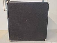 Front view of black cloth-grille speaker cabinet