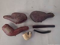 Closed leather cases and separate stems and bowl