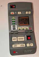 Front view of tricorder open showing screen and controls