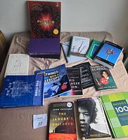 Overall view of all books laid out on bed