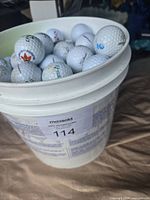 Full view of bucket with golf balls