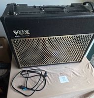 Front view of Vox AD100VT amplifier and power cable