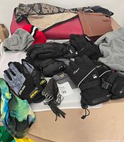 Overview showing gloves, yoga mat, scarf, hats, clutches