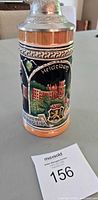 Front view showing Heidelberg castle scene and lid